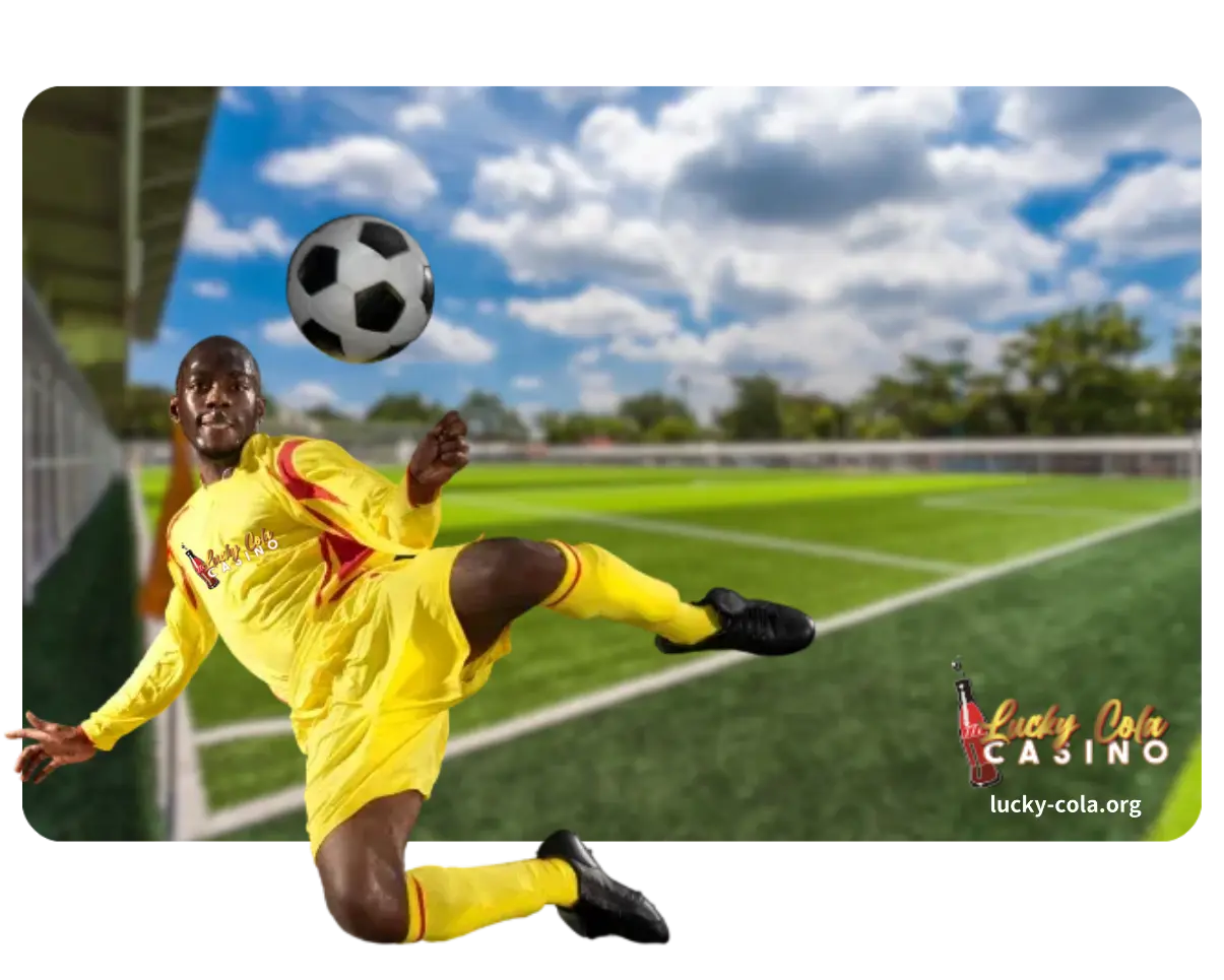 A professional soccer player in a yellow jersey kicking a football on a green field under a blue sky.